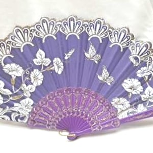 May include: A purple hand fan with a white lace trim and a floral design. The fan is decorated with gold glitter and features butterflies and flowers.