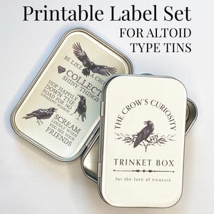 May include: Printable label set for Altoid-type tins. The labels feature crow illustrations and phrases like "Collect Shiny Things" and "Scream Loudly When You See Your Friends." The trinket box label reads "The Crow's Curiosity."