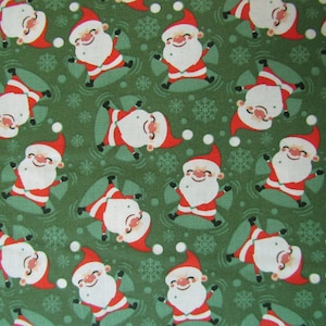 Christmas Fabric - Snow Angel Santa on Green Fabric, Fabric By The Yard, 100% Cotton