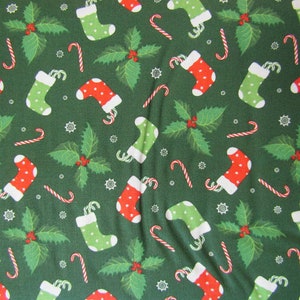 Christmas Fabric - Stocking Toss on Green Fabric, Fabric By The Yard, 100% Cotton