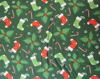 Christmas Fabric - Stocking Toss on Green Fabric, Fabric By The Yard, 100% Cotton