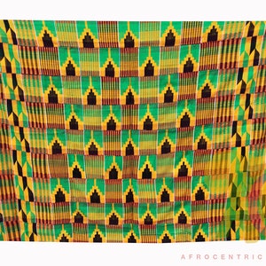 May include: A colorful fabric with a geometric pattern in shades of green, yellow, black, and red. The fabric is woven with a repeating design of squares and triangles.