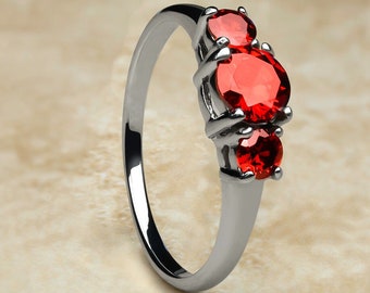 Robijn solitaire titanium trouwring, zilveren titanium ring, verlovingsring, jubileumring, zilver titanium, trouwring dames