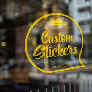May include: Yellow circle sticker with a crown and the text "Custom Stickers" and the text "StickersFox" below.