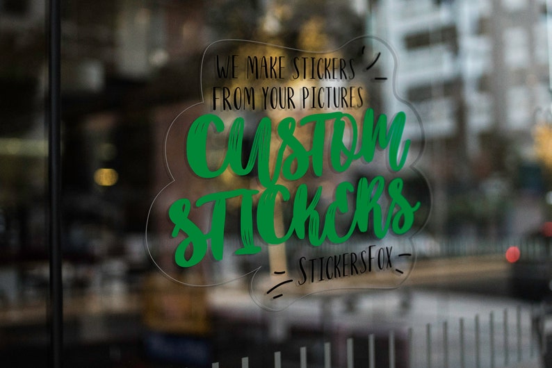 May include: A green and black custom sticker design on a clear glass surface. The sticker says "We make stickers from your pictures Custom Stickers - StickersFox - "