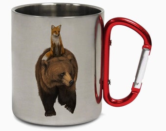 May include: A stainless steel travel mug with a red carabiner handle. The mug features a graphic of a brown bear with a red fox sitting on its back.