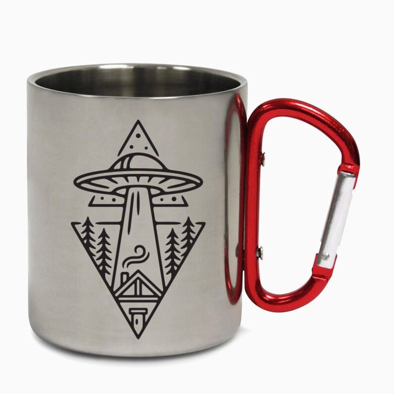 May include: A stainless steel travel mug with a red carabiner handle. The mug features a black and white graphic of a UFO over a house with trees in a triangle shape.
