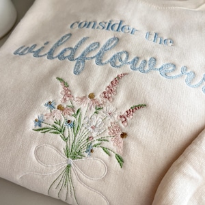 Embroidered Wildflower Sweatshirt – Luke 12:27 Christian Verse
