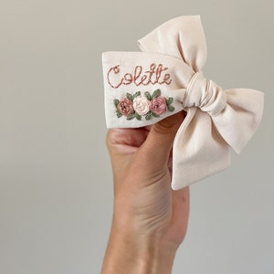 Floral Hand Embroidered Bow - hand embroidered name bow with florals - baby girl bow - baby announcement - baby bow - custom embroidered bow