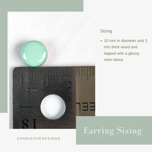 stud earring sizing by candi cove designs, 10 mm in diameter and 3 mm thick wood and topped with a glossy resin dome, featuring a picture of a mint dot stud earrings and a silver ruler