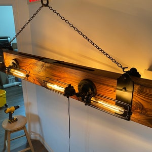 View of Rustic Chic Beam Chandelier - Etsy