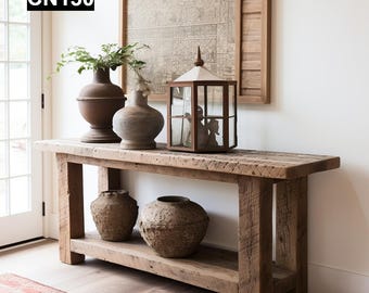 May include: A rustic wooden console table with a lower shelf, displaying decorative vases and a lantern. The table is made of reclaimed wood and has a natural finish. The text "CN130" is in the top left corner.