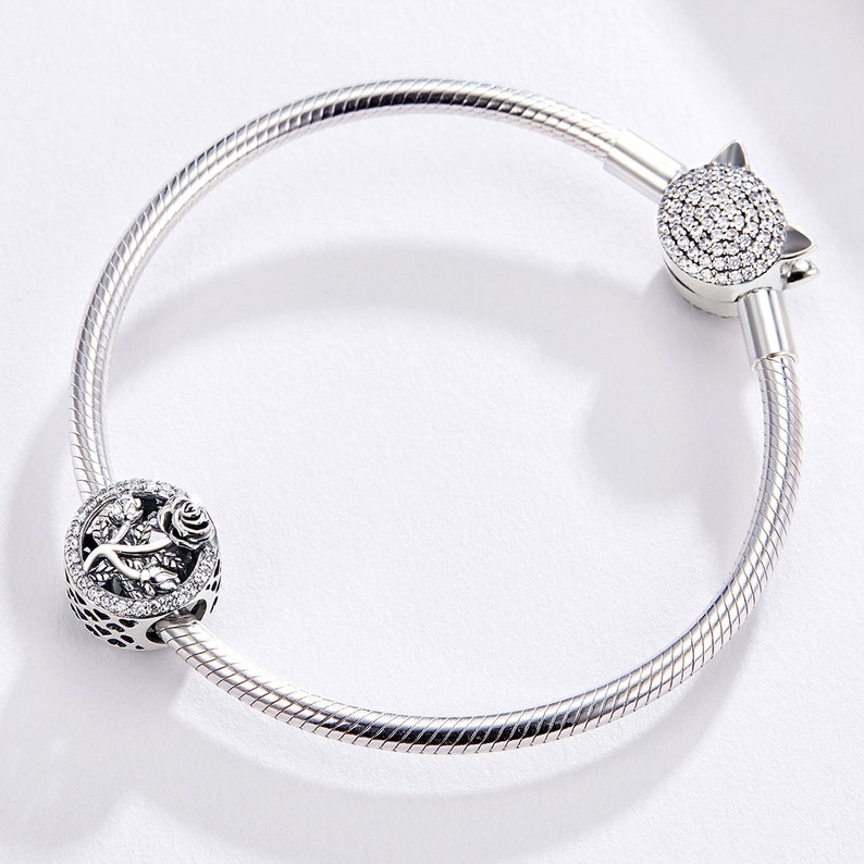 Bracciale Regolabile Qina In Argento 925 Con Ciondolo Cuore E Piuma – Marito E Moglie