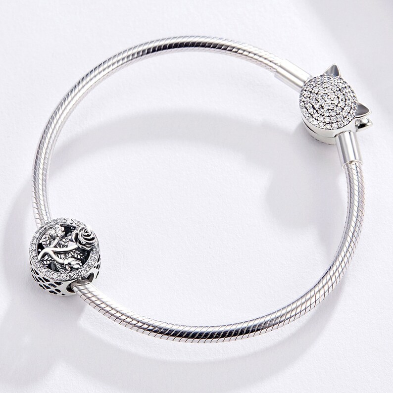 Bracciale Regolabile Qina In Argento 925 Con Ciondolo Cuore E Piuma – Marito E Moglie