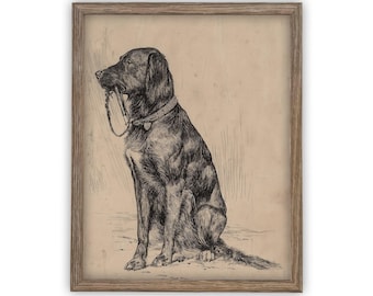 May include: A framed black and white ink drawing on aged paper depicting a seated dog wearing a collar and holding a leash in its mouth. The artwork is enclosed in a simple, light brown wooden frame with a visible grain texture.