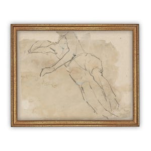 May include: A framed charcoal and wash drawing on off-white paper depicting a reclining figure in a relaxed pose. The artwork features loose, expressive dark lines defining the body, set against a light brown wash background, enclosed in a gold frame.
