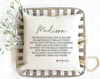 May include: Cream-colored pillow with the name "Madison" in script. The pillow features a heartfelt message about love and missing someone, with a small red heart and "Mom & Dad" at the bottom. The pillow is placed in a decorative tray.
