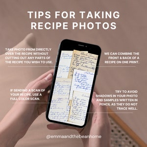 May include: A close-up of a hand holding a smartphone displaying a handwritten recipe. The recipe is written on several small pieces of paper, with the text "Black Choc Chip Cookies" visible. The caption below the image reads "@emmaandthebeanhome".