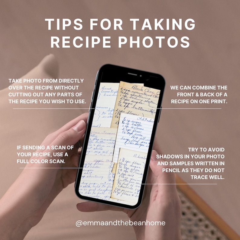 May include: A close-up of a hand holding a smartphone displaying a handwritten recipe. The recipe is written on several small pieces of paper, with the text "Black Choc Chip Cookies" visible. The caption below the image reads "@emmaandthebeanhome".
