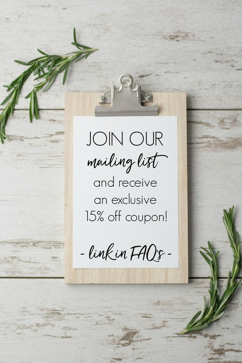May include: A white sign with black text on a wooden clipboard. The sign says "JOIN OUR mailing list and receive an exclusive 15% off coupon! - link in FAQ's - "
