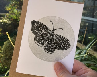 Black butterfly with silver moon, an original lino printed card