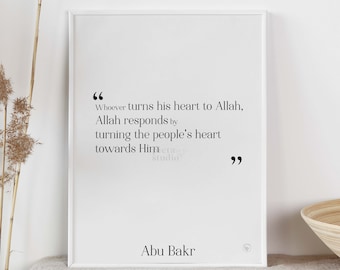 May include: A white framed print with a black and white quote by Abu Bakr. The quote reads: "Whoever turns his heart to Allah, Allah responds by turning the people's heart towards Him."