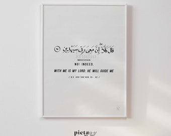 May include: A black and white printable art print with an Arabic quote in a white frame. The quote translates to "No! Indeed, with me is my Lord: He will guide me." The quote is from the Quran, Surah Ash-Shu'ara 26:62.
