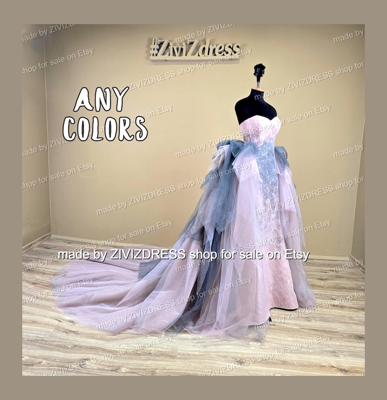 May include: A strapless, floor-length gown in shades of pink and blue, displayed on a mannequin. The dress features a layered skirt and a long train. The text "ANY COLORS" is visible in the image.