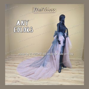 May include: A black mannequin in a layered gown with a long train. The gown has a colour gradient from blue to pink. The image includes the text "ANY COLORS" and "made by ZIVIZDRESS shop for sale on Etsy."