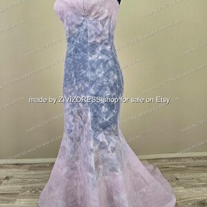 May include: A floor-length, sleeveless gown with a mermaid silhouette. The dress features a geometric pattern in shades of lavender and gray. The text "made by ZIVIZDRESS shop for sale on Etsy" is repeated around the dress.