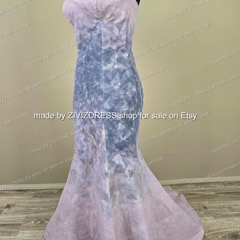 May include: A floor-length, sleeveless gown with a mermaid silhouette. The dress features a geometric pattern in shades of lavender and gray. The text "made by ZIVIZDRESS shop for sale on Etsy" is repeated around the dress.
