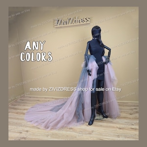 May include: A black mannequin wearing a black dress with a layered tulle skirt in shades of pink and grey. The text "ANY COLORS" is displayed. The shop name "ZIVIZDRESS" is also visible.