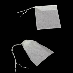 May include: Two white tea bags with strings. One tea bag is square and the other is a pouch shape.