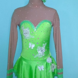 Competition ice figure skating dress. Size Child 9/10. Neon green color, rhinestones, hair piece. Tinkerbell, Disney.