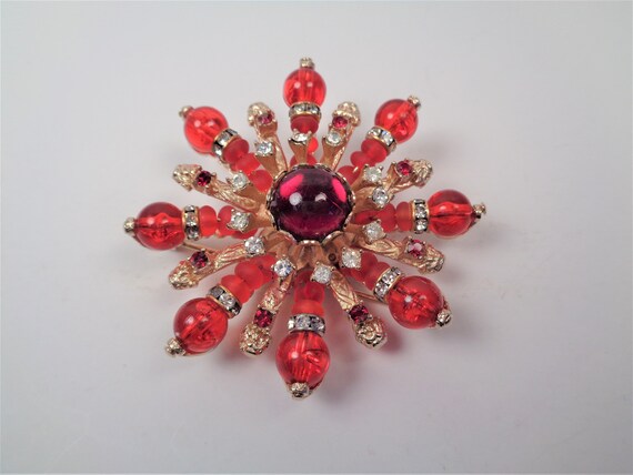 red brooch