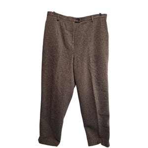 May include: A set of three ceramic mugs with a speckled, matte finish. The mugs are in shades of cream, light gray, and dark gray. Each mug has a simple, minimalist design, perfect for coffee or tea.