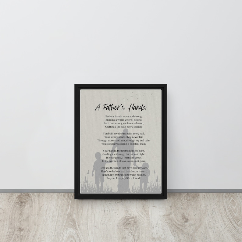 May include: A black and white framed print with a poem about a father's hands. The poem reads "A Father's Hands" and includes the text "Father's hands, worn and strong, Building a world where I belong. Each line a story, each scar a lesson, Crafting a life with every session."