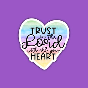 May include: A rainbow heart-shaped sticker with the text "TRUST in the Lord with all your HEART".