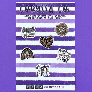 May include: A set of six stickers featuring leopard print designs with various phrases, including "Leopard is my favorite", "Stay Wild", "Positive Vibes Only", and "Always Be Kind".