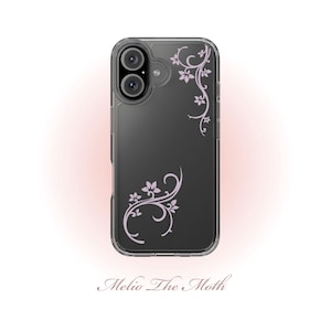 May include: A transparent phone case with a black interior, featuring a light purple floral vine pattern. The case has a dual-lens camera aperture and the text "Melio The Moth" at the bottom.