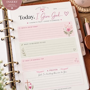 May include: An A5 journal insert page featuring the title Today, I Give God, with sections for What's On My Heart, What I'm Releasing To God, What I'm Grateful For, and A Prayer. The page includes pink and green accents, floral illustrations, and hearts.