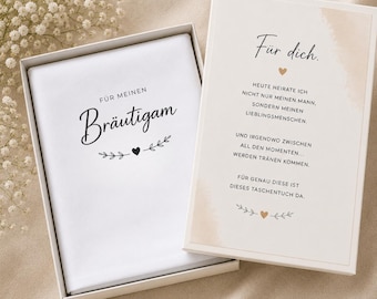 May include: A white gift box with a white handkerchief inside. The handkerchief has the words "FÜR MEINEN Bräutigam" in black script. The box also contains a card with text in German.
