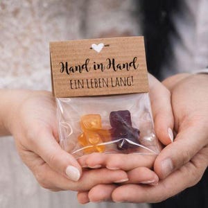 Wedding favors: gummy bear bags | Modern wedding table decorations | Hand in hand for a lifetime | Glad you're here | Candy bar idea