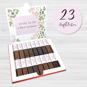 May include: A box of assorted chocolate bars with a floral design on the lid. The box is open and the chocolate bars are visible. The chocolate bars are wrapped in white paper with text in German. The text on the lid says "Danke an die weltbeste Brautmutter".
