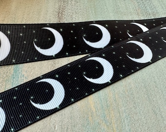May include: Black ribbon with a white crescent moon and star pattern.
