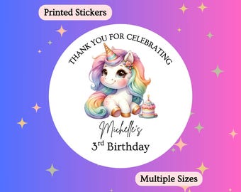 May include: Round sticker with a watercolor illustration of a unicorn with a rainbow mane and tail. The text reads "Thank you for celebrating" and "Michelle's 3rd Birthday". The sticker has a pink and purple background with stars.