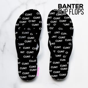 May include: Black flip-flops with the word "CUNT" in white repeated across the surface. The text "BANTER FLIP FLOPS" is at the top in black. The background is white with a marble pattern.