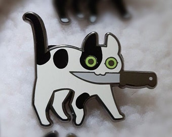 Black and white spotted Knifecat Enamel Pin