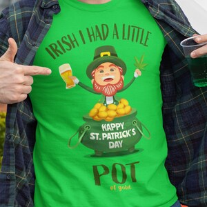 May include: A green t-shirt with a cartoon leprechaun holding a beer and a pot of gold. The shirt says "Irish I had a little... Happy St. Patrick's Day... Pot of Gold".