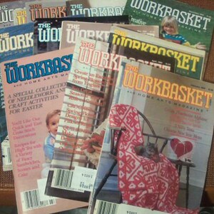 May include: A stack of vintage Workbasket magazines featuring craft projects and home decor ideas. The magazines have a colourful cover with a variety of needlework and craft projects.